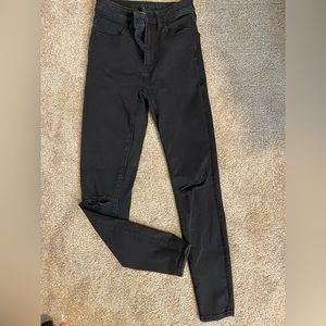 Black skinny jeans with knee holes